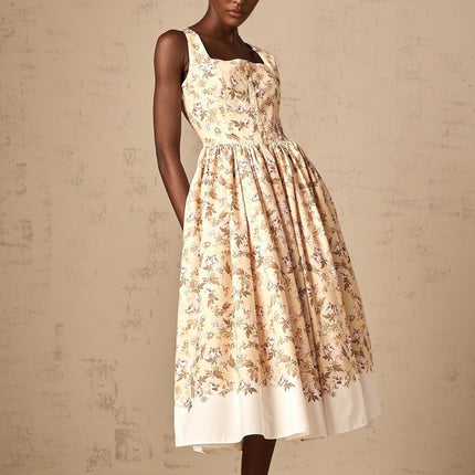 A yellow midi dress with a floral print pattern and button details