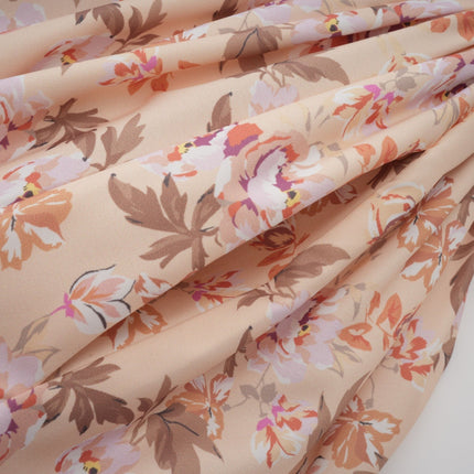 A yellow midi dress with a floral print pattern and button details