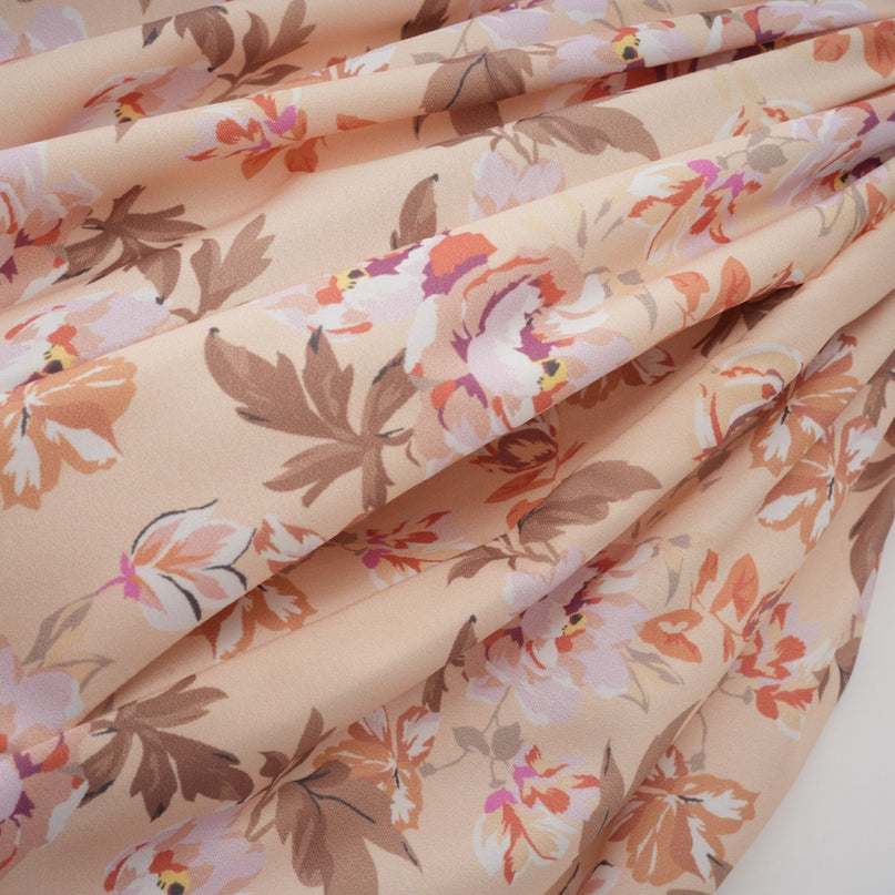 A yellow midi dress with a floral print pattern and button details