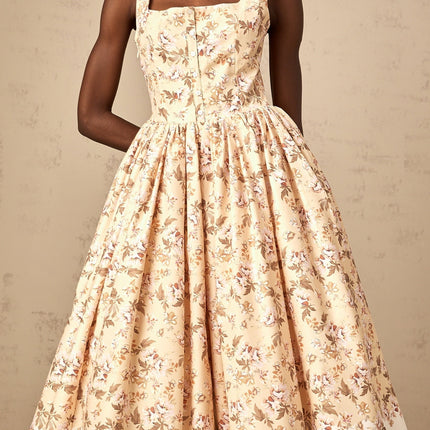 A yellow midi dress with a floral print pattern and button details