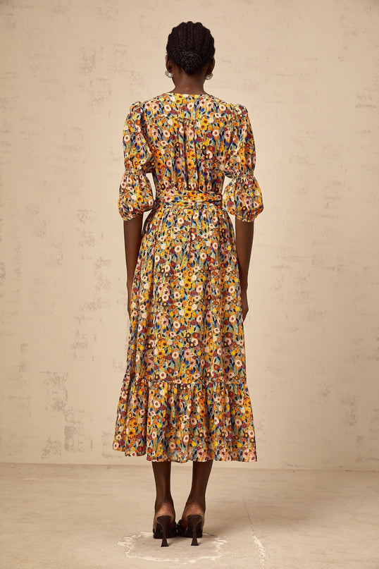 A yellow midi dress with a floral print pattern and Vneck design named Éliane