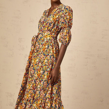 A yellow midi dress with a floral print pattern and Vneck design