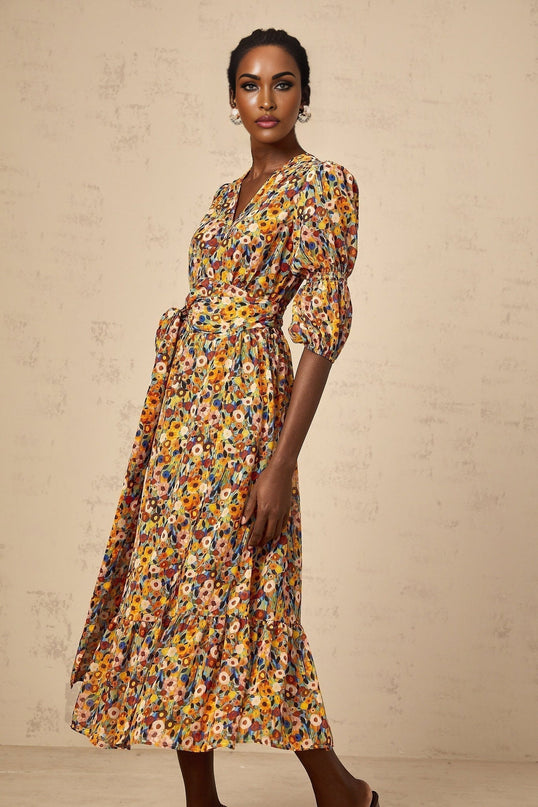 A yellow midi dress with a floral print pattern and Vneck design