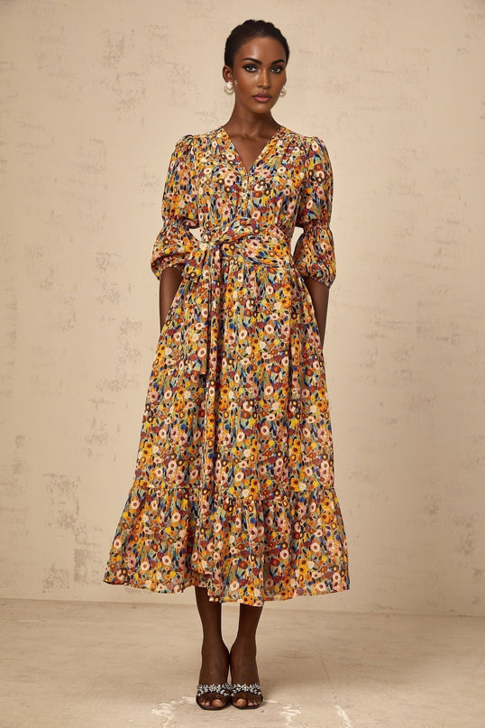 A yellow midi dress with a floral print pattern and Vneckline named Éliane