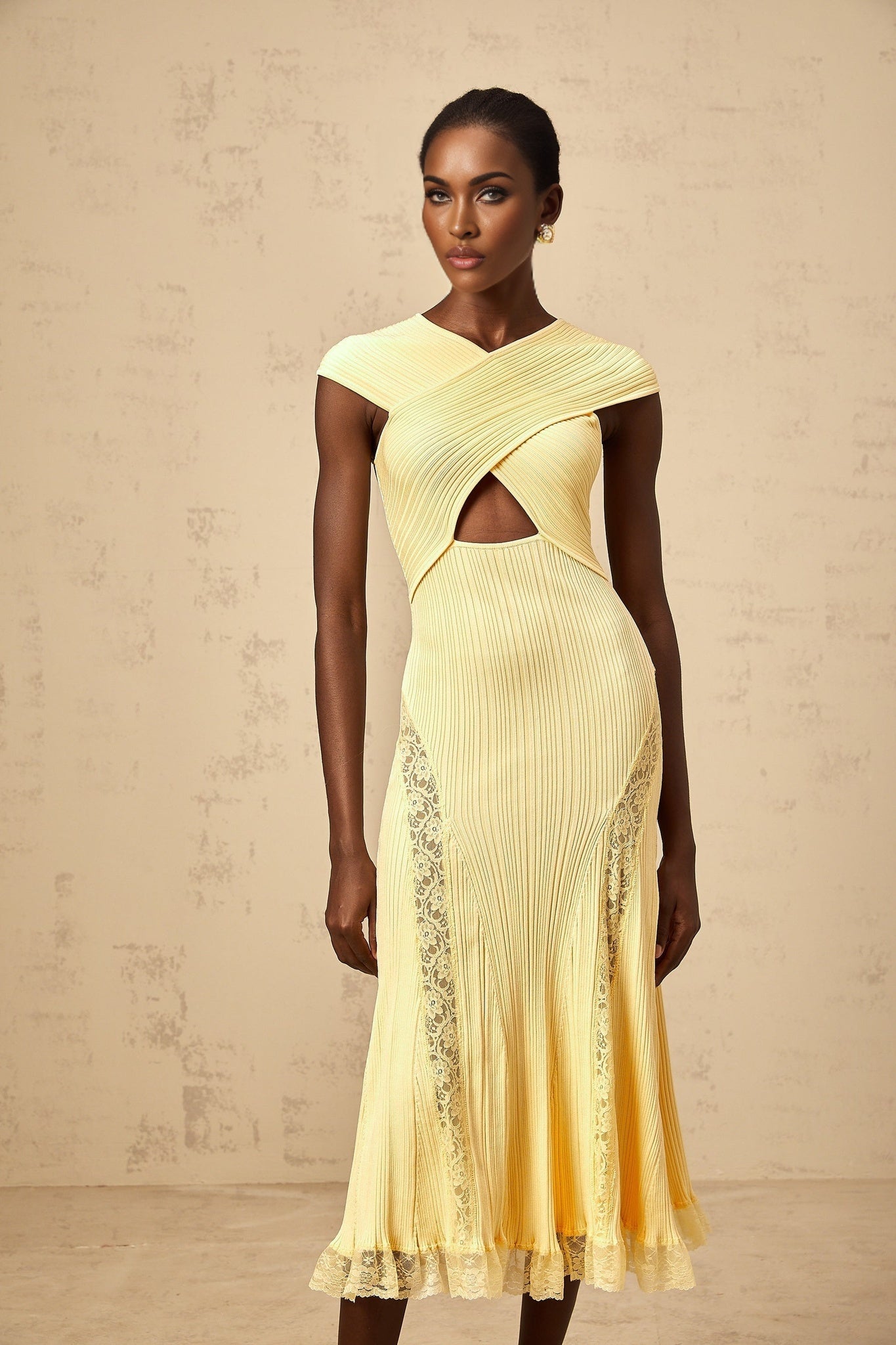A yellow midi dress with ribbed knit fabric and lace panel details featuring a fitted silhouette and long sleeves