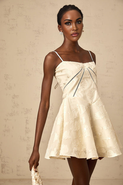 Adabella white mini dress with floral jacquard pattern on a plain background