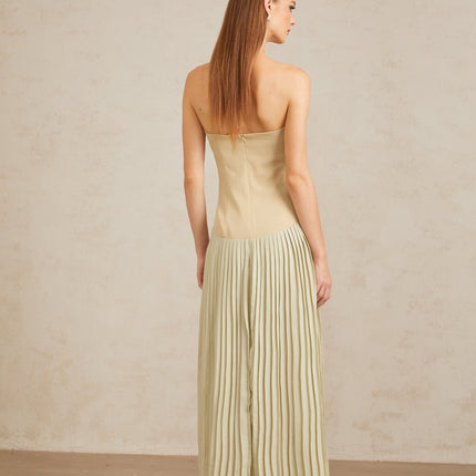 Adalgisa Maxi Dress in Green pleated corset off-shoulder silhouette built-in cups fitted waistline corset-style bodice exquisite pleated design rear zip fastening 100% Terylene fiber