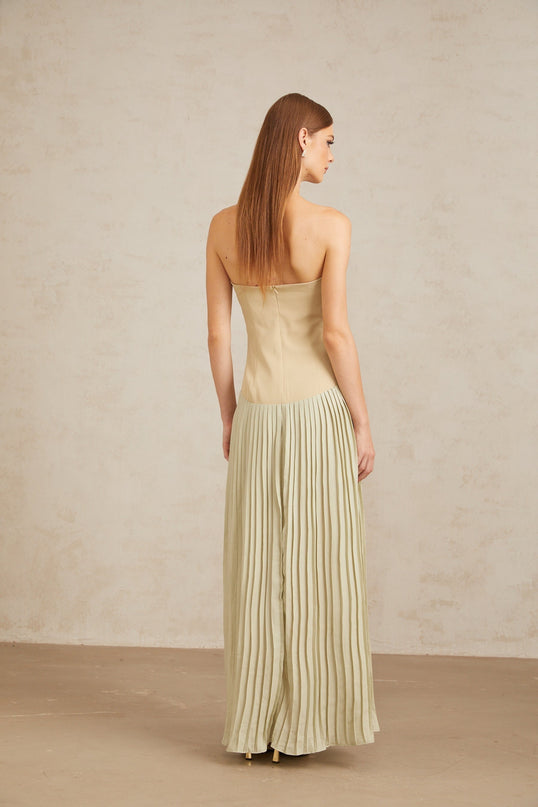 Adalgisa Maxi Dress in Green pleated corset off-shoulder silhouette built-in cups fitted waistline corset-style bodice exquisite pleated design rear zip fastening 100% Terylene fiber