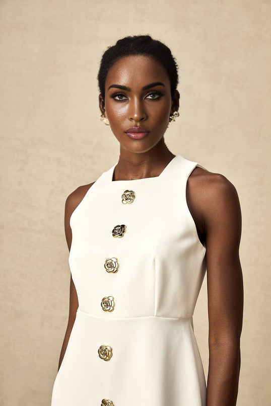 Adrielle White Sleeveless Mini Dress With Decorative Buttons Square Neckline Gold-Toned Buttons Floral Structure Back Zipper Puff Skirt Thigh-Length Silhouette Elegant Gatherings Summer Events Chic Versatile