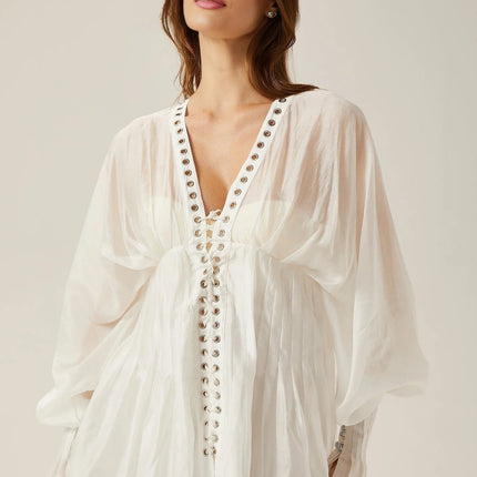 Agata White Mini Dress V-neck Cinched Waist Puff Sleeves Front Tie Fastening Rear Zip Closure Semi-sheer Elegant Sophisticated Luxurious Formal Events Upscale Gatherings Timeless Beauty