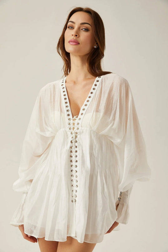 Agata White Mini Dress V-neck Cinched Waist Puff Sleeves Front Tie Fastening Rear Zip Closure Semi-sheer Elegant Sophisticated Luxurious Formal Events Upscale Gatherings Timeless Beauty