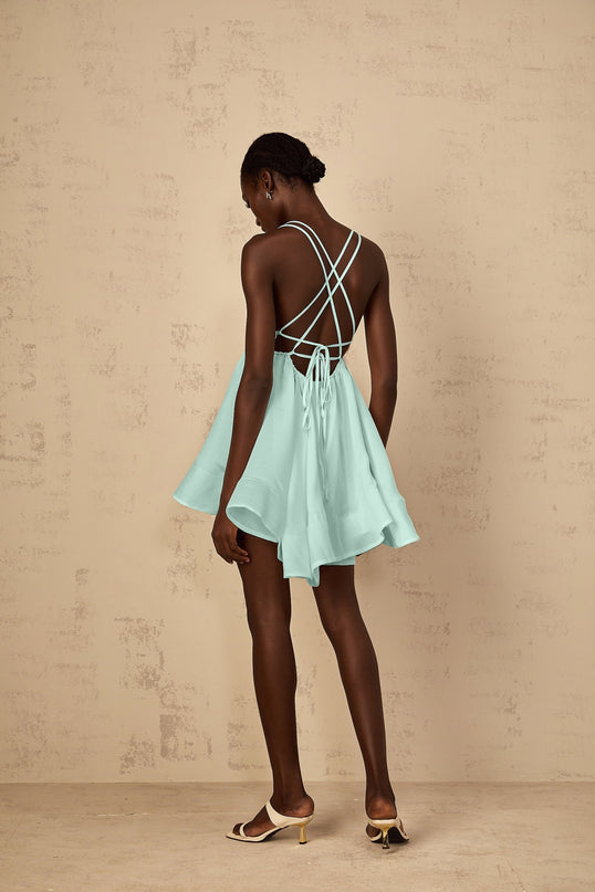 Agnese Green Mini Dress V-neck Sleeveless Tencel Terylene Fiber Shirred Asymmetrical Flounce Hem Thigh-length Self-tie Cross-over Straps High-low Silhouette Chic Detail Fashion Statement
