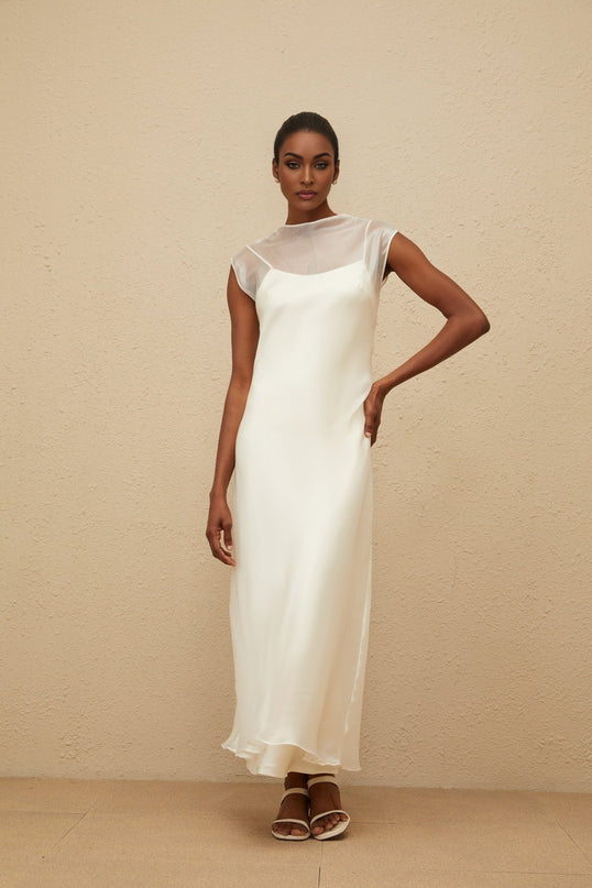 Agnese White Maxi Dress with Sheer Shoulders and Flared Hem