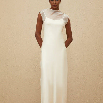 Agnese White Maxi Dress luxury tulle masterpiece sheer shoulder design floor-length dramatic silhouette round neck sleeveless style rear button fastening slip satin lining special occasions standout piece luxury style