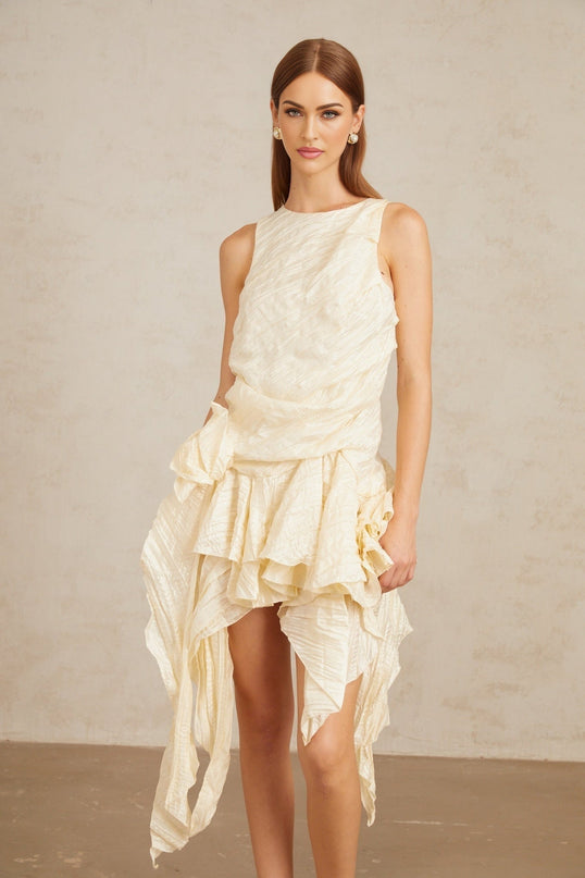 Alba Mini Dress Multicolor Neutrals Asymmetrical Floral Ruffles Sleeveless Round neck Cinched waist Pressed creases 3D-petal detailing Ruffled accents Asymmetrical hem Rear zip fastening Mini length Terylene fiber elegance sophistication