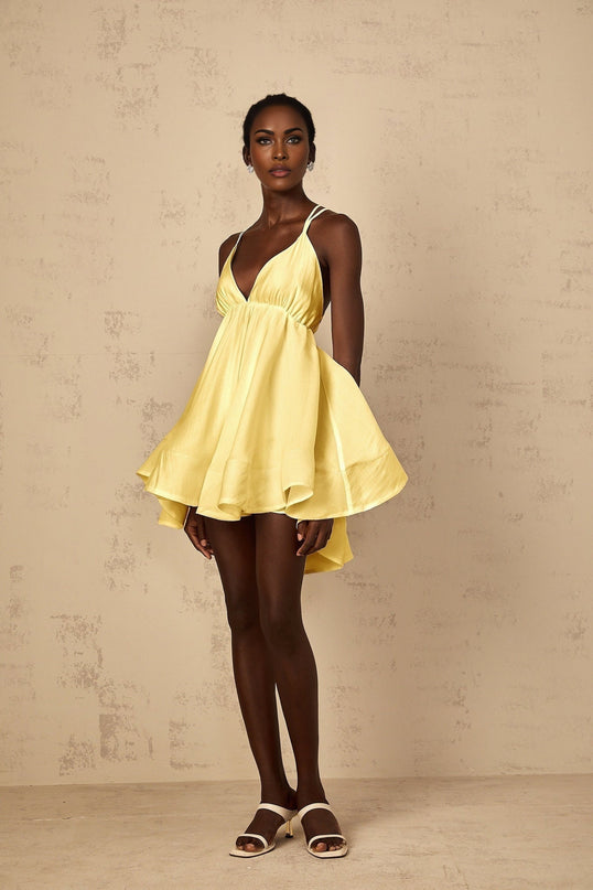 Alba Mini Dress in Radiant Yellow Sleeveless V-Neck Self-Tie Cross-Over Straps Shirred Asymmetrical Flounce Hem Thigh-Length Slip-On Luxury Blend High-Low Silhouette