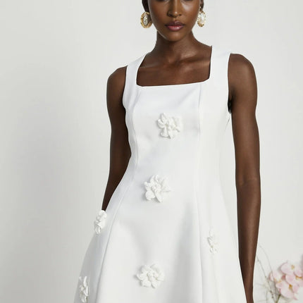 Alessandra White Mini Dress with Faux-Flower Embellishment Square Neck and Flared Skirt Rear Zip Fastening Thigh-Length 79% Polyester 21% Elastane