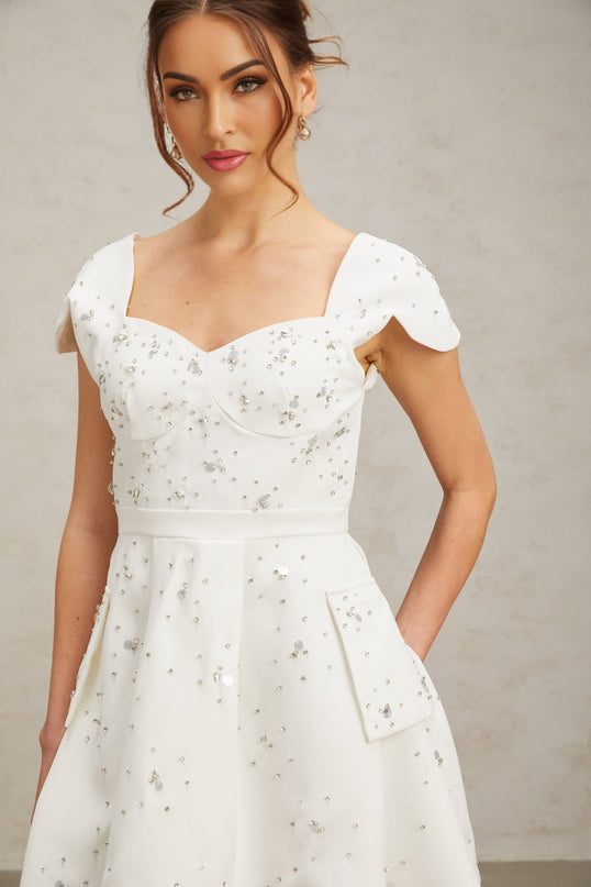 Alessandrina White Mini Dress Sweetheart Neck Cap Sleeves Bustier Style Rhinestone Embellishment Flounce Hem Rear Zip Fastening Thigh Length Terylene Fabric