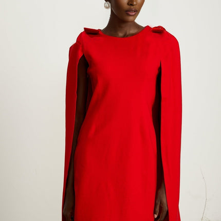 Alexandra Bright Red Mini Dress boat neck long sleeves cape design bow detailing side zip fastening thigh-length silhouette luxurious blend of 91% Rayon and 9% Silk timeless masterpiece
