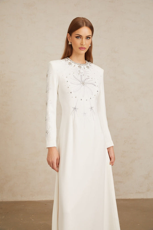 Aloïse White Embellished Maxi Gown with crystal and rhinestone embellishments, round neck, long sleeves, and fitted waistline