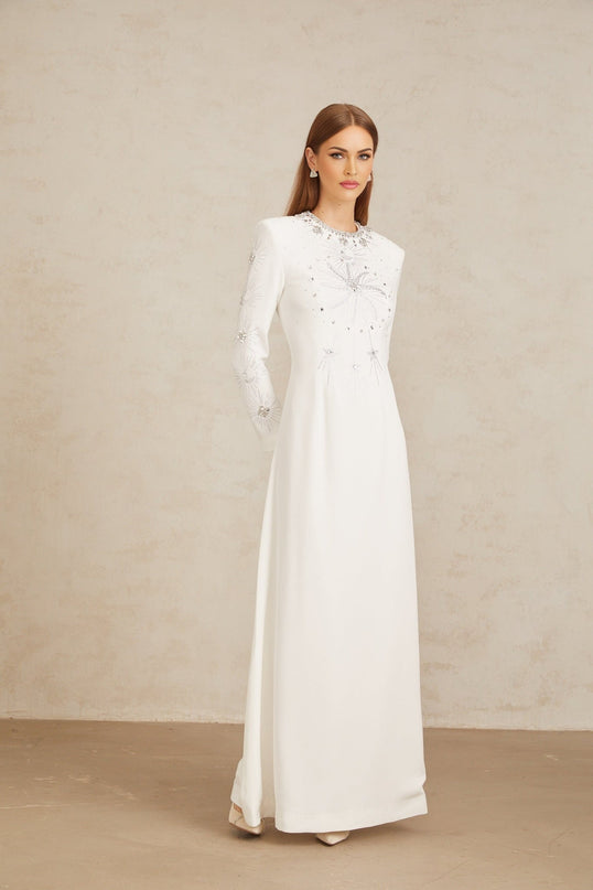 Aloïse White Embellished Maxi Gown with crystal and rhinestone embellishments, round neck, long sleeves, and fitted waistline