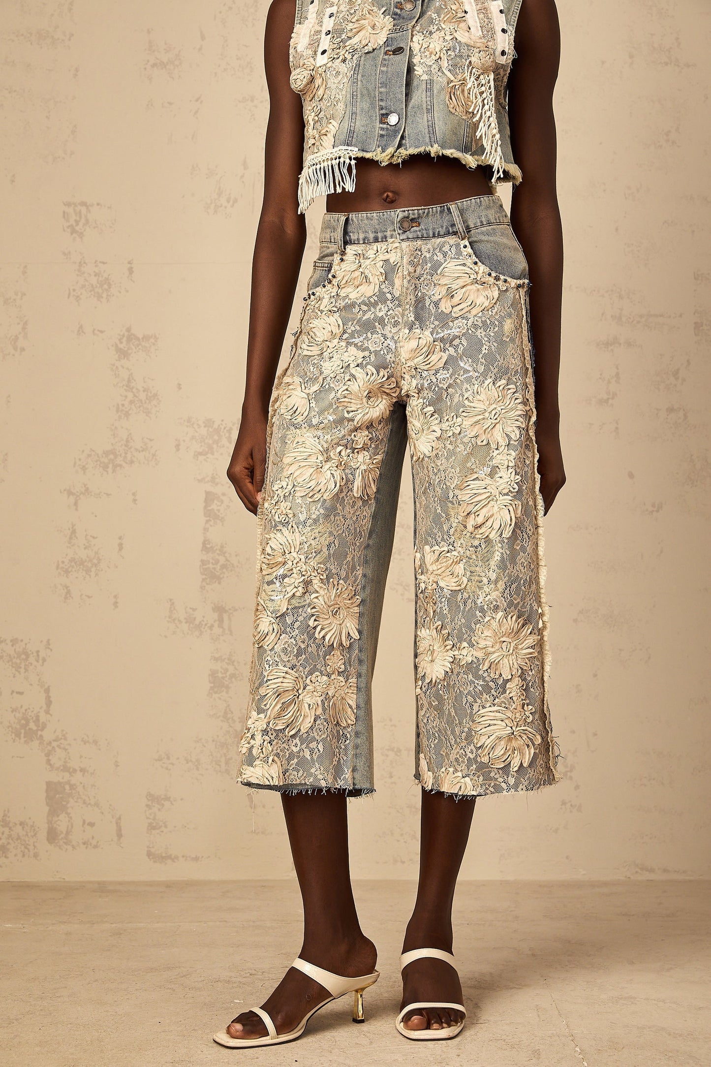 Amaryllis brand denim jeans with blue floral lace panels on the sides