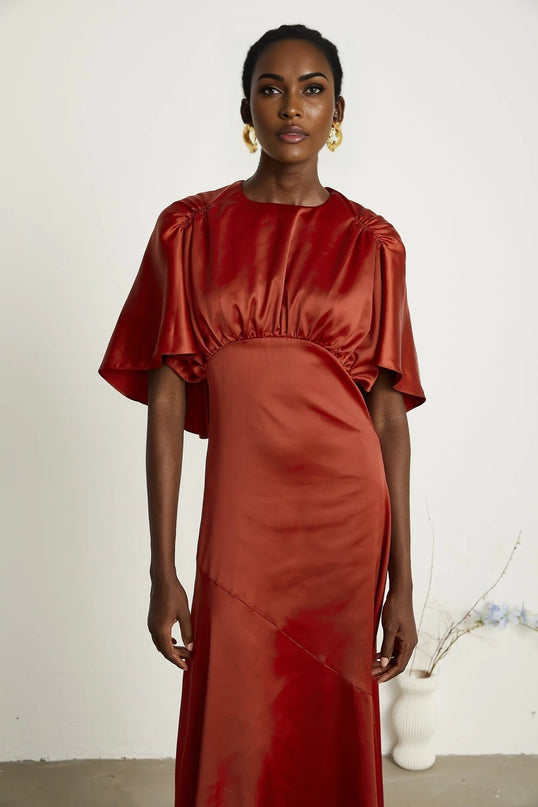 Amelina Red Satin Maxi Dress Crew Neck Cape Sleeves Gathered Detailing Fitted Waist Open Back Asymmetric Hem Rear Zip Fastening 100% Viscose