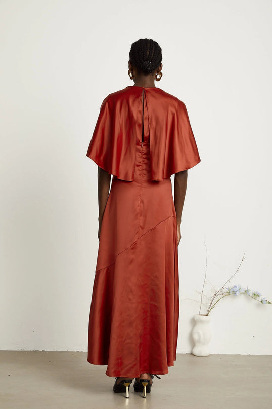 Amelina Red Satin Maxi Dress Crew Neck Cape Sleeves Gathered Detailing Fitted Waist Open Back Asymmetric Hem Rear Zip Fastening 100% Viscose