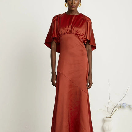 Amelina Red Satin Maxi Dress Crew Neck Cape Sleeves Gathered Detailing Fitted Waist Open Back Asymmetric Hem Rear Zip Fastening Viscose