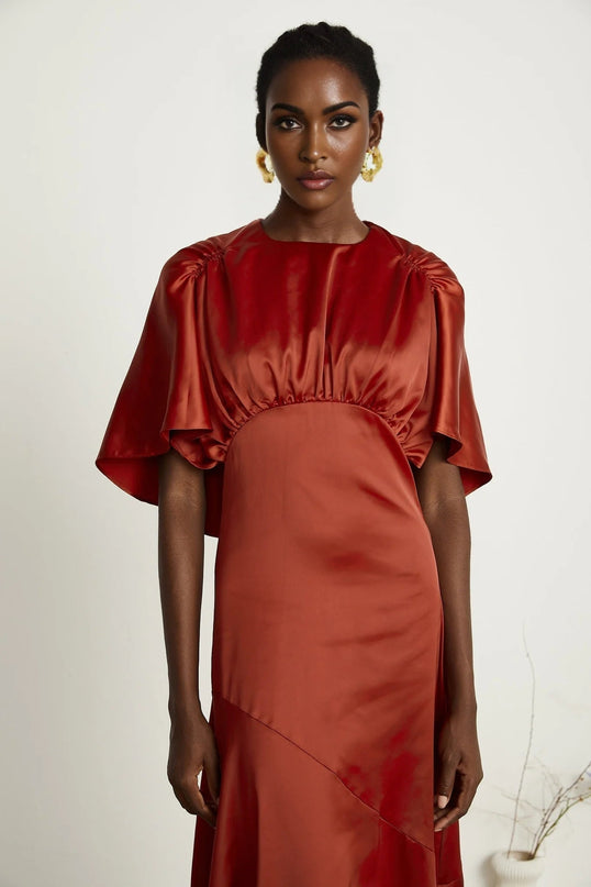 Amelina Red Satin Maxi Dress Crew Neck Cape Sleeves Gathered Detailing Fitted Waist Open Back Asymmetric Hem Rear Zip Fastening 100% Viscose