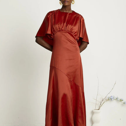 Amelina Red Satin Maxi Dress with Cape Sleeves Crew Neck Gathered Detailing Fitted Waist Open Back Asymmetric Hem Rear Zip Fastening 100% Viscose