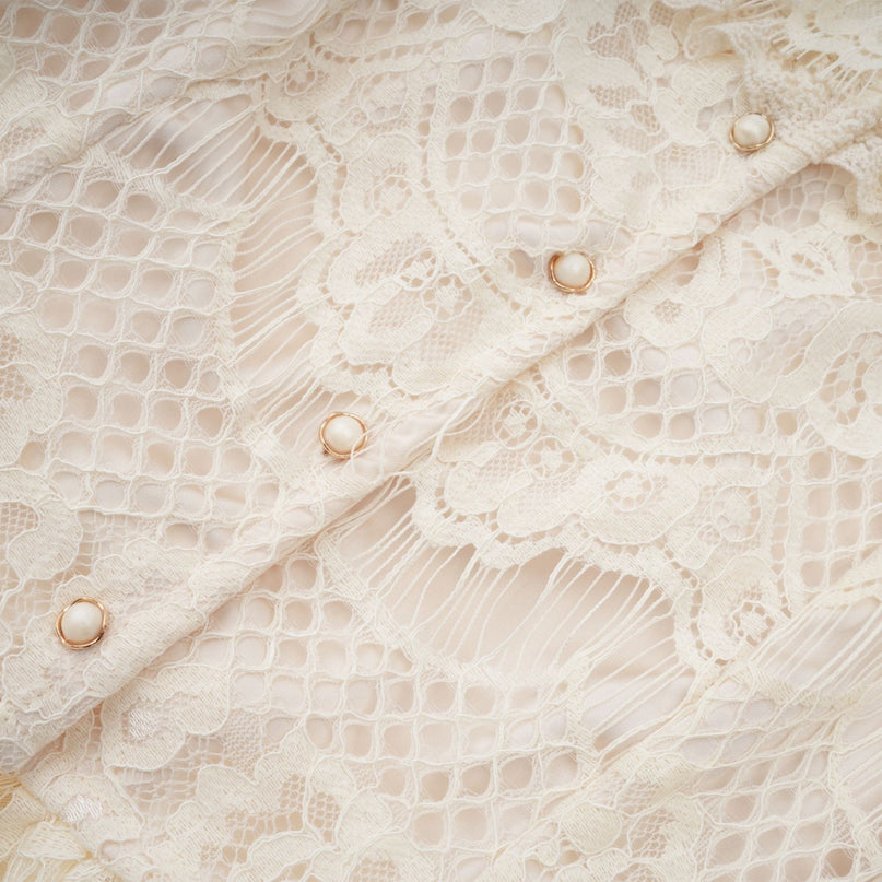 Anaelle off white blouse with a bow and floral lace pattern