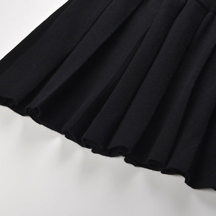 Angel wearing Black Flared Pleated Skirt with Gold Decorative Buttons