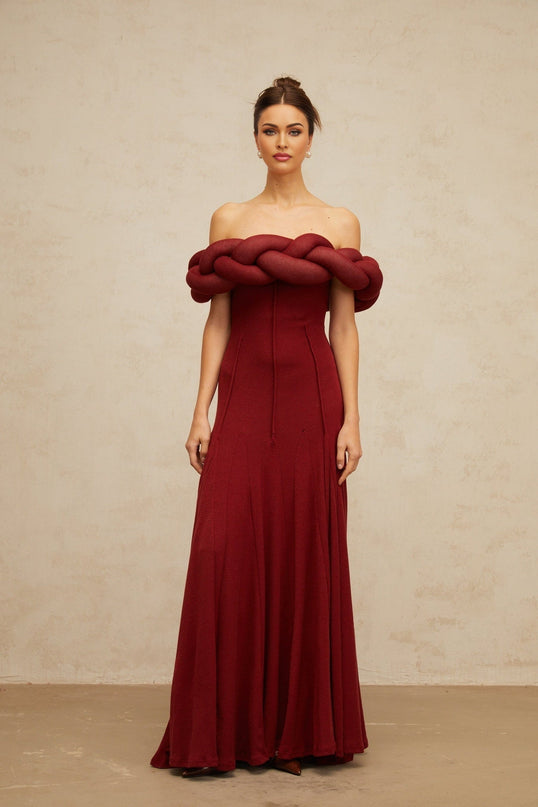 Angioletta Red Maxi Dress Knit Braid Godet Pleats Off-Shoulder Sleeveless Fitted Waistline Intricate Detailing Rear Zip Fastening 100% Terylene Fiber Composition