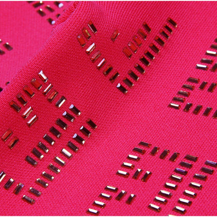 Anita wearing Pink Geometric Cutout Cardigan and Skirt Set with Gold Details