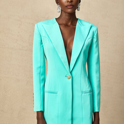 Annalee Mint Green Mini Dress Long Sleeves Peak Lapels Shoulder Pads Cinched Waist Embossed Buttons Jetted Pockets Structured Silhouette Opulent Chic Convenient Luxurious Blend Terylene Cotton Viscose Fashion Forward Wardrobe