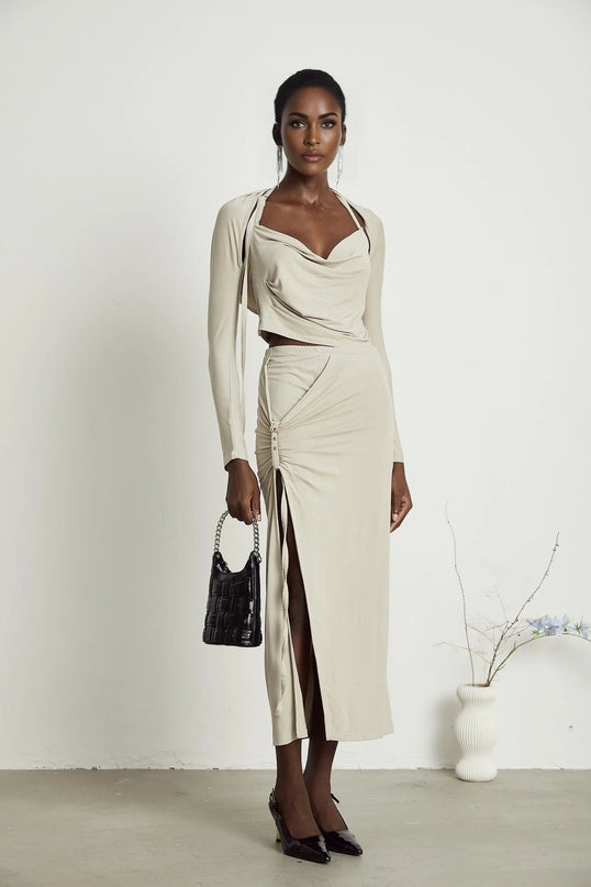 Annalisa Light Khaki Grey Skirt Top Set Matching Outfit Cupro Elastane Cowl Neck Long Sleeves Adjustable Pin-Buckle Halter Strap Low-Rise Silhouette Side Slit Gold-Tone Buckle Fastening Decorative Knot Calf-Length Hem