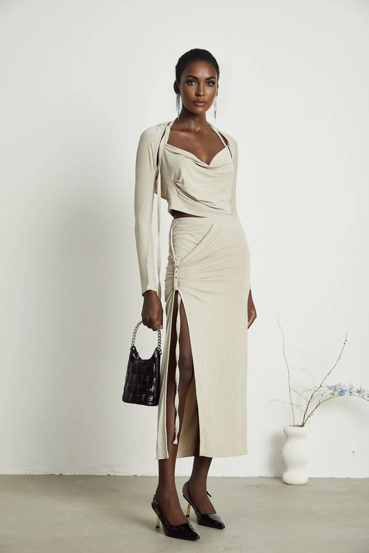 Annalisa Light Khaki Grey Skirt Top Set Matching Outfit Cupro Elastane Cowl Neck Long Sleeves Cut-Out Design Pin-Buckle Halter Strap Low-Rise Silhouette Gathered Effect Side Slit Gold-Tone Buckle Fastening Decorative Knot Calf-Length Hem