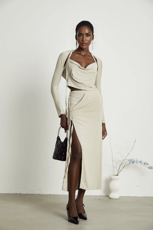 Annalisa Light Khaki Grey Skirt Top Set Matching Outfit Cupro Elastane Cowl Neck Long Sleeves Cut-Out Design Pin-Buckle Halter Strap Low-Rise Silhouette Gathered Effect Side Slit Gold-Tone Buckle Fastening Decorative Knot Calf-Length Hem