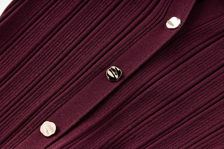 Annie wearing Deep Burgundy Ribbed Knit Bodycon Dress with Flared Hem and Button Details