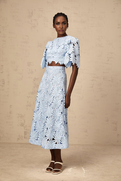 Audrey blue matching set with guipure lace top and skirt worn by model on plain background