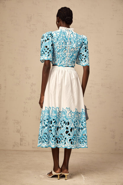 Aurore blue two piece outfit featuring cut out details and embroidery on both top and skirt