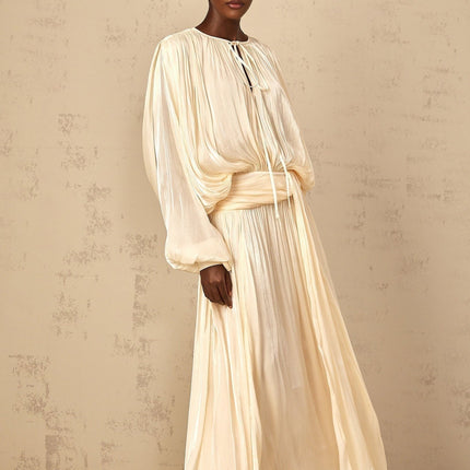 Barbara Maxi Dress in Neutrals Pleated Ruffled Glitter Long Buttoned-Cuff Sleeves Twist Neckline Semi-Sheer Shoulder Pads Drape Regal Charm Luxurious Blend Rear Button Side Zip Fastening Elegant