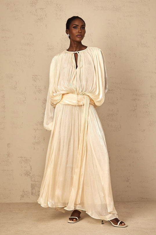 Barbara Maxi Dress in Neutrals Pleated Ruffled Glitter Semi-Sheer Twist Neckline Shoulder Pads Regal Charm Luxurious Blend Elegant