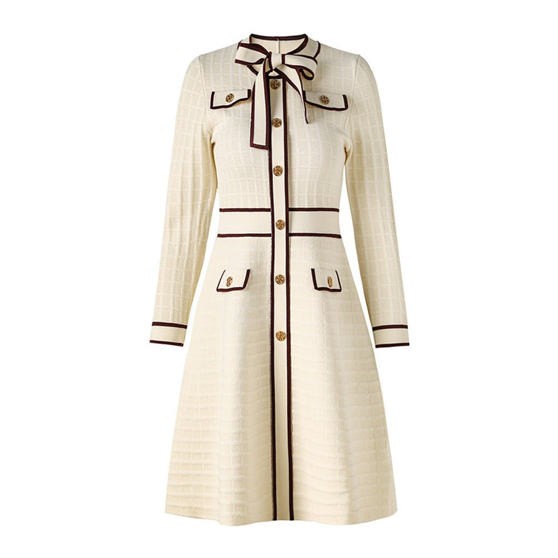 Beige knit A-line dress with bow-tie detail and gold-tone buttons
