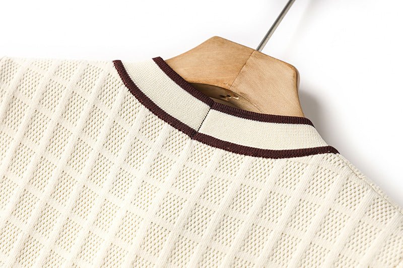 Beige knit A-line dress with bow-tie detail and gold-tone buttons