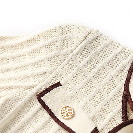 Beige knit A-line dress with brown piping and bow-tie detail