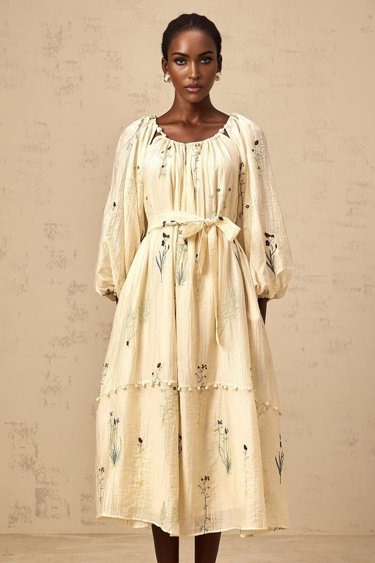 Beige midi dress with floral embroidery and beaded details featuring the Uranie design