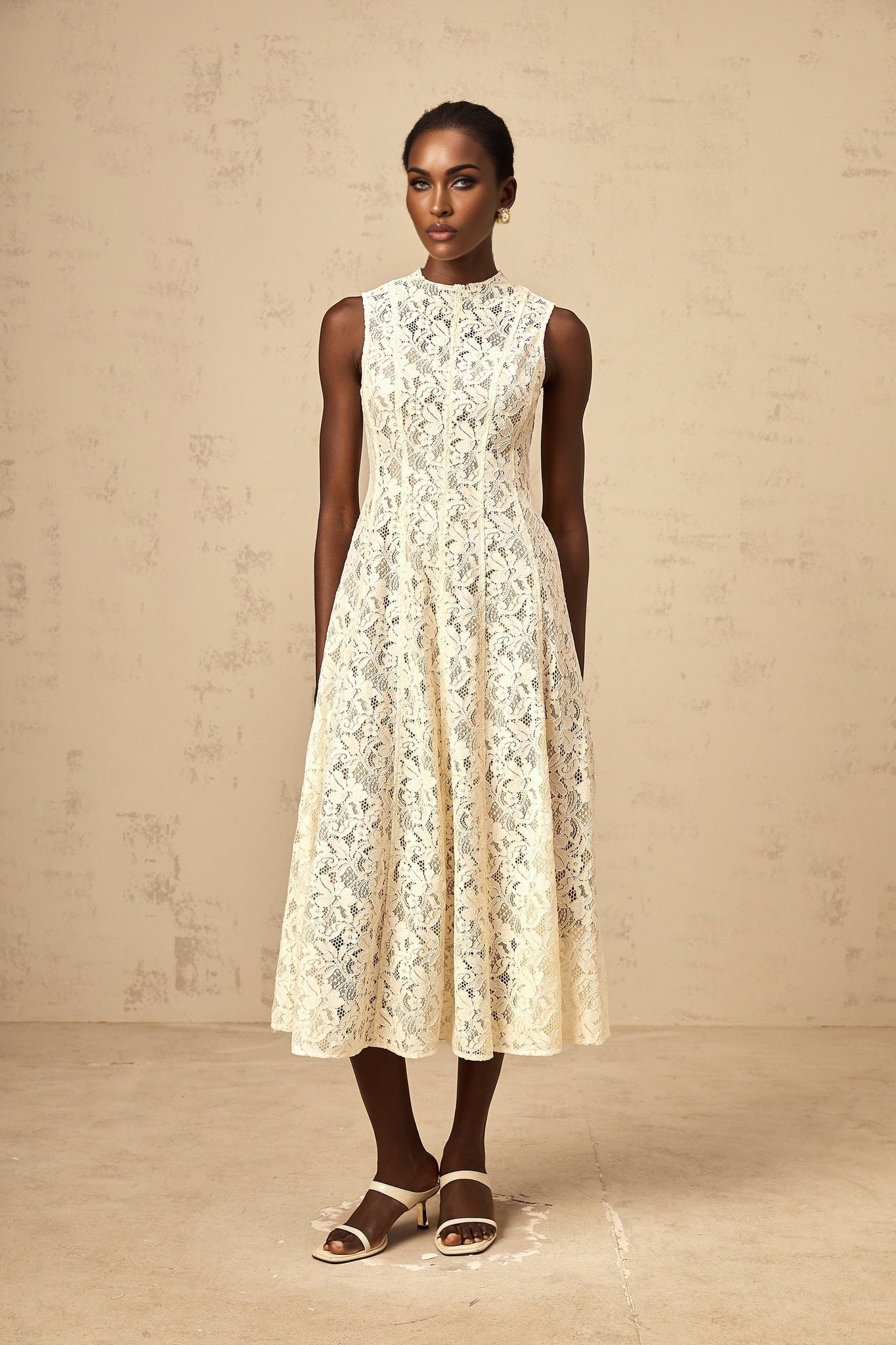 Beige midi dress with floral lace pattern and flared skirt design