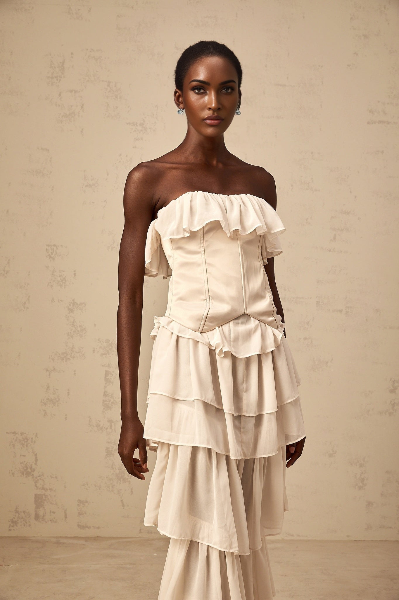 Beige off shoulder tiered dress and corset set with matching design